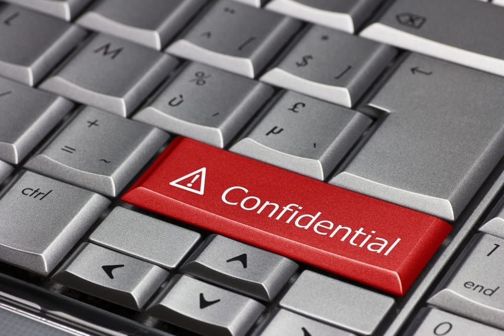 A mock up of a desktop keyboard with a "Confidential" key