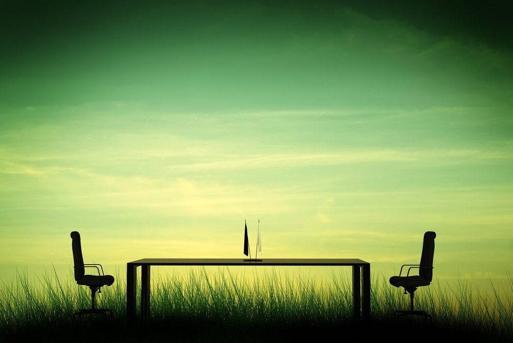 table with two empty chairs opposite each other