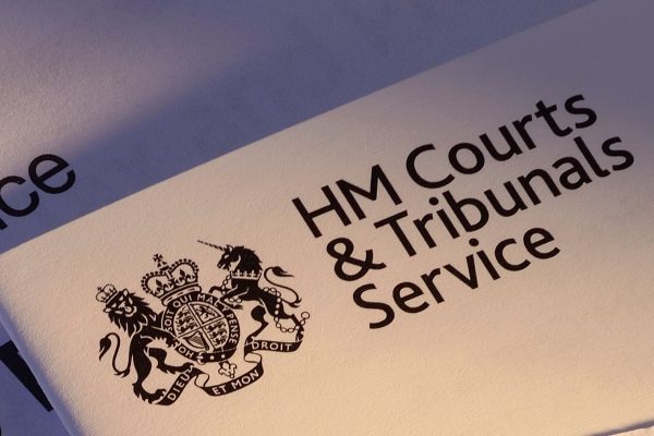 paperwork with employment tribunal logo