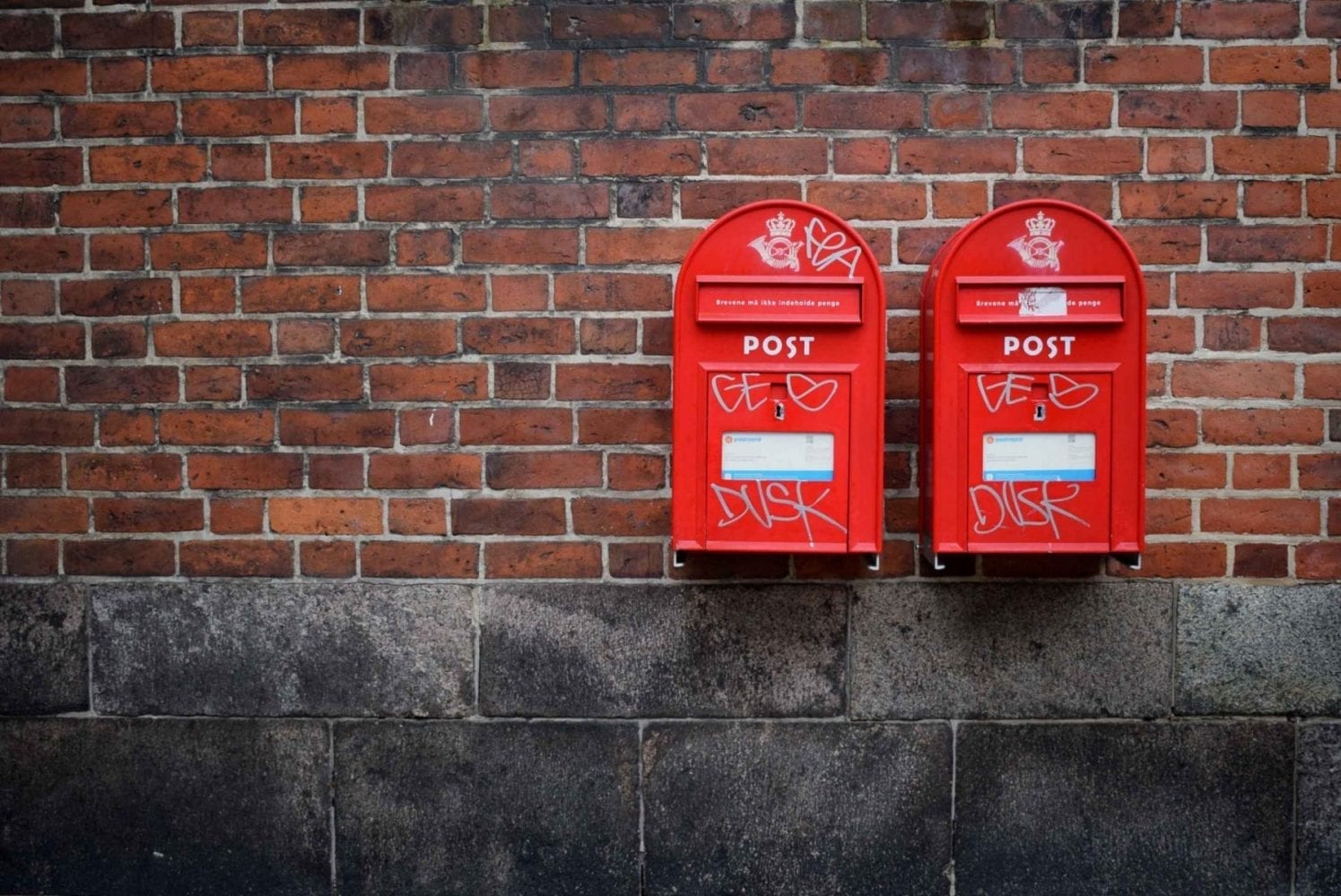 Two pox boxes on a street