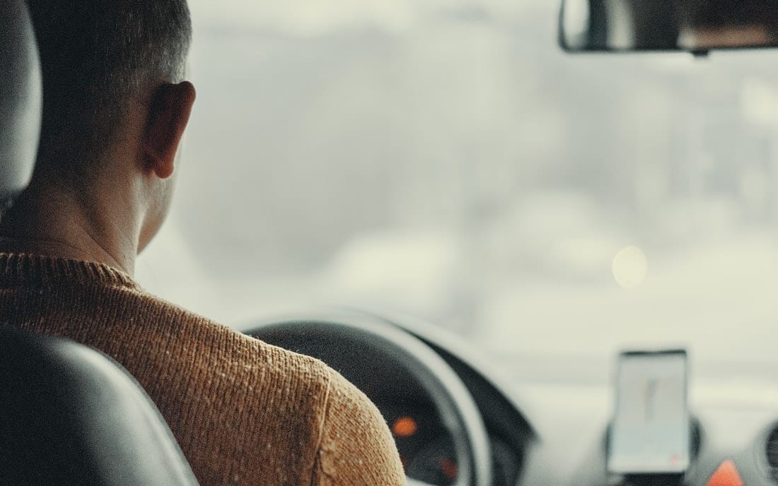 A person driving a vehicle